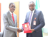 Mr Bello Hassan, Managing Director and Chief Executive Officer of NDIC (left) and Barrister Ola Olukoyede, EFCC Chairman.