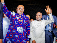 Governor Otti (right) and Apostle Chibuzo acknowledging cheers from the congregation.