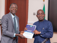 Governor Otti receives some literature on the RoLAC programme from Mr. Danladi Plang.