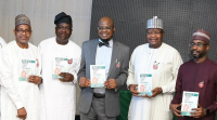 * L-R: Prof. Muhammed Abubakar, Managing Director, Galaxy Backbone; Prof. Adeolu Akande, Chairman, Board of Commissioners, Nigerian Communications Commission (NCC); Prof. Isa Ali Ibrahim Pantami, Minister of Communications and Digital Economy;  Prof. Umar Garba Danbatta, Executive Vice Chairman/CEO, NCC and Mr. Kashifu Abdullahi, Director General, National Information Technology Development Agency, at the launch of Information Technology infrastructure projects for small businesses and public presentation of  a book by the Minister in Abuja on Thursday.